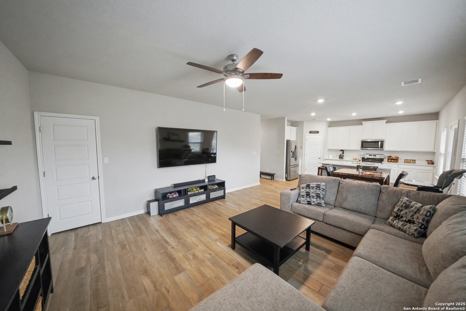 3083 Mondavi Crest Schertz, TX 78154 - Photo 11 of 47 a living room with furniture and a flat screen tv