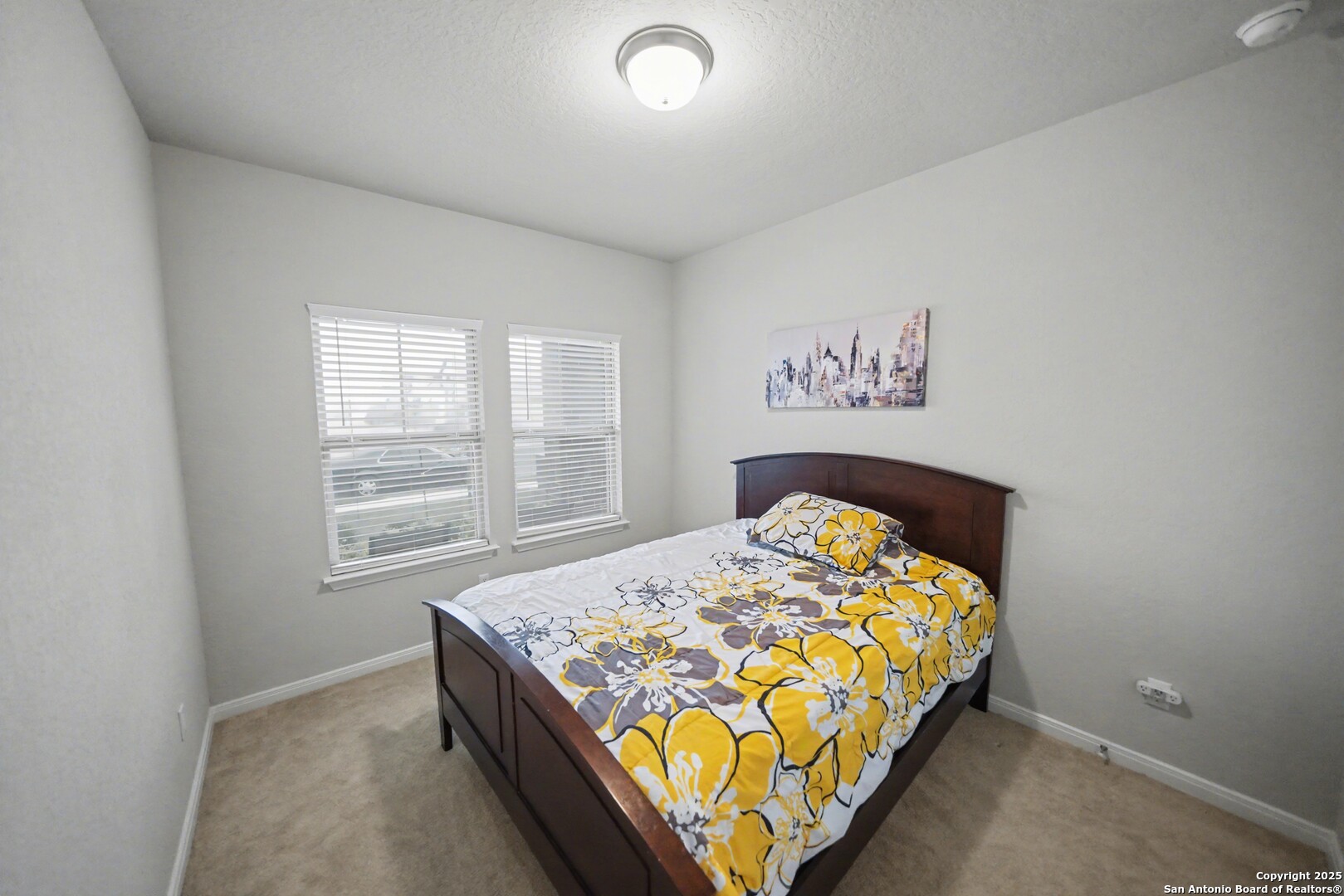 3083 Mondavi Crest Schertz, TX 78154 - Photo 20 of 47 a bed sitting in a bedroom next to a window