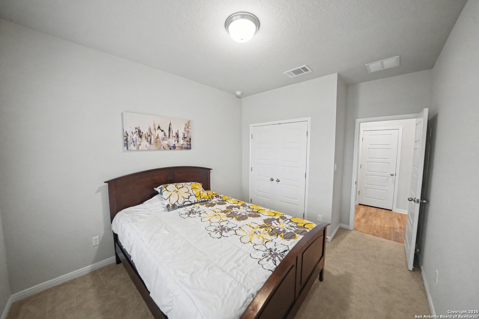 3083 Mondavi Crest Schertz, TX 78154 - Photo 21 of 47 a bedroom with a bed and a table
