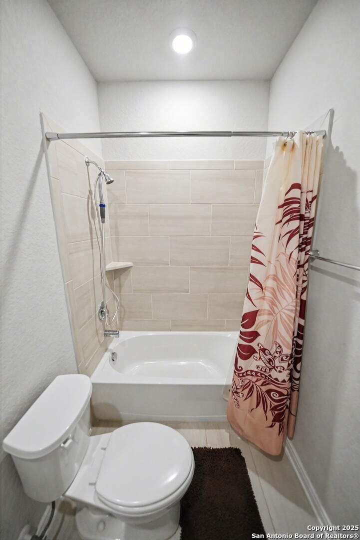 3083 Mondavi Crest Schertz, TX 78154 - Photo 23 of 47 a white toilet sitting next to a bath tub and a shower