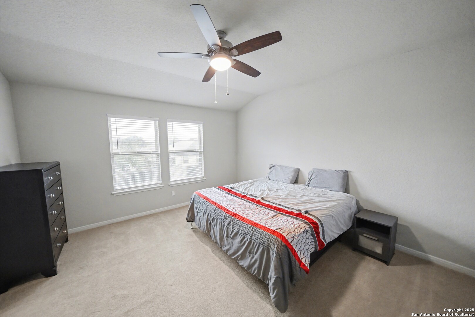 3083 Mondavi Crest Schertz, TX 78154 - Photo 24 of 47 a bedroom with a bed and a window