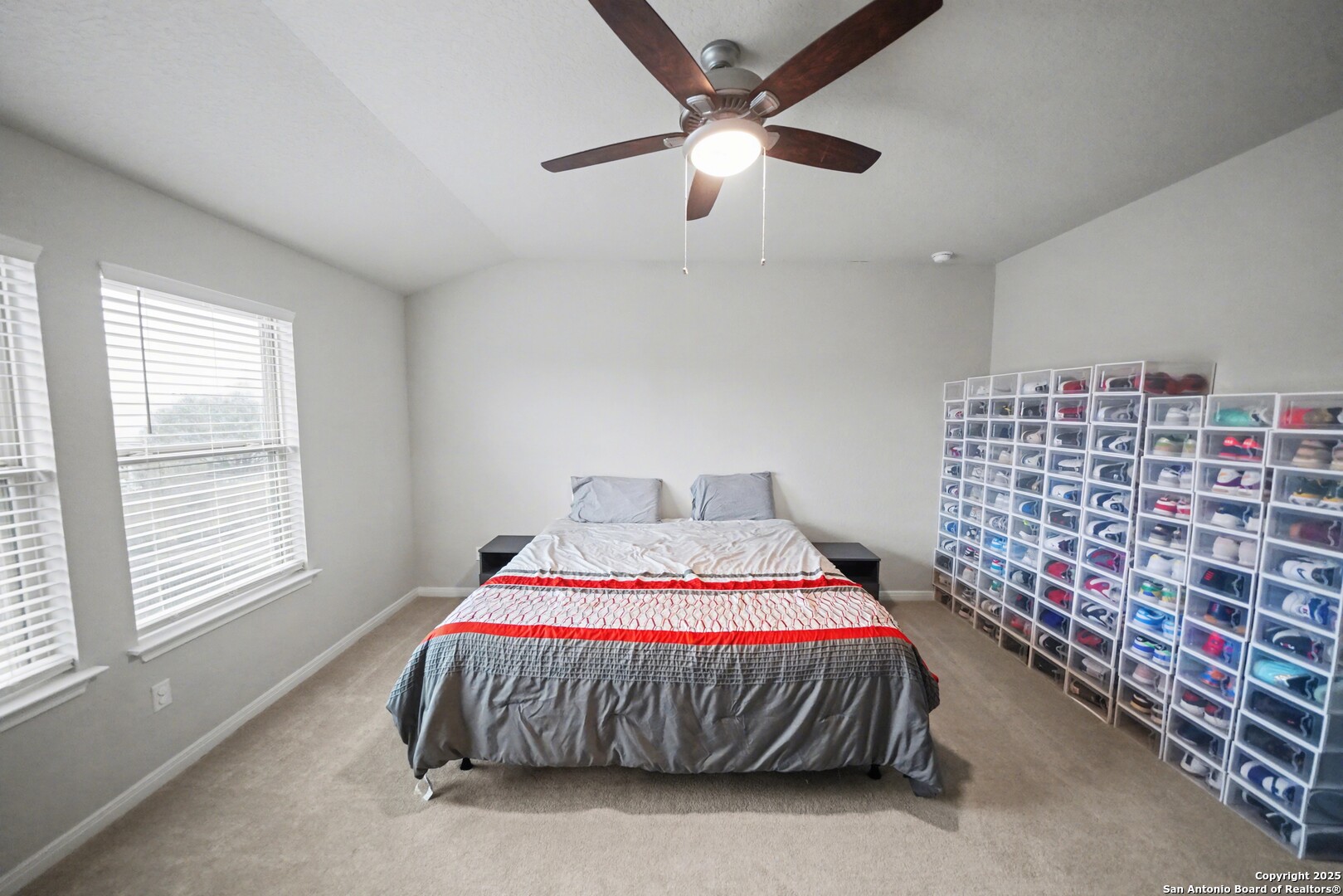 3083 Mondavi Crest Schertz, TX 78154 - Photo 25 of 47 a bed sitting in a bedroom next to a window