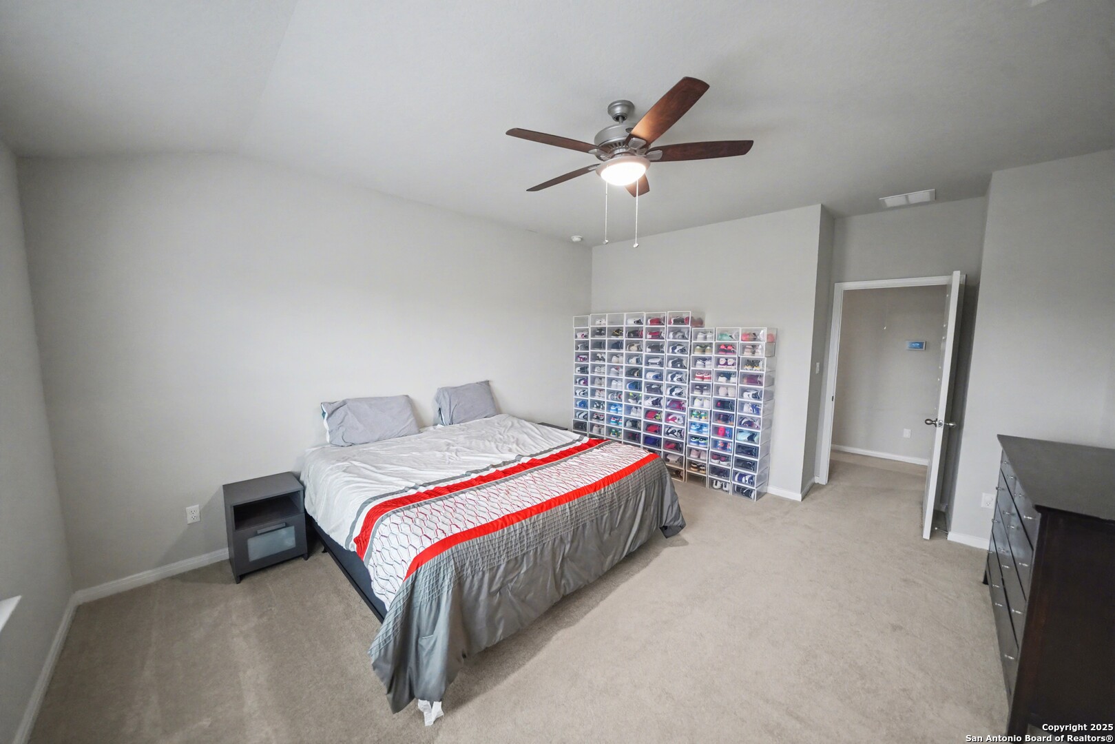 3083 Mondavi Crest Schertz, TX 78154 - Photo 26 of 47 a bed room with a bed and a ceiling fan