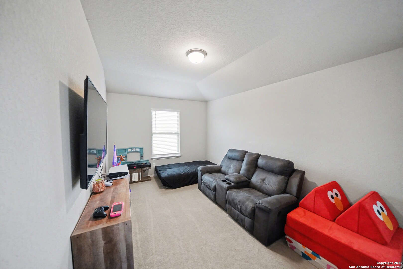 3083 Mondavi Crest Schertz, TX 78154 - Photo 30 of 47 a living room with furniture a flat screen tv and a window