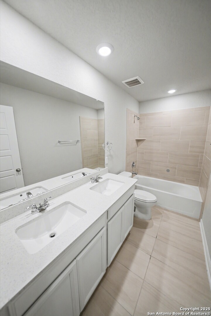 3083 Mondavi Crest Schertz, TX 78154 - Photo 37 of 47 a spacious bathroom with a bathtub sink and mirror