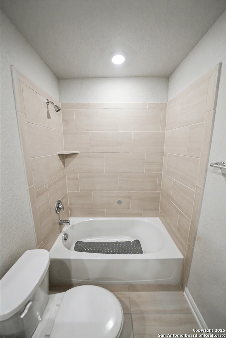 3083 Mondavi Crest Schertz, TX 78154 - Photo 38 of 47 a bathroom with a toilet and a bathtub