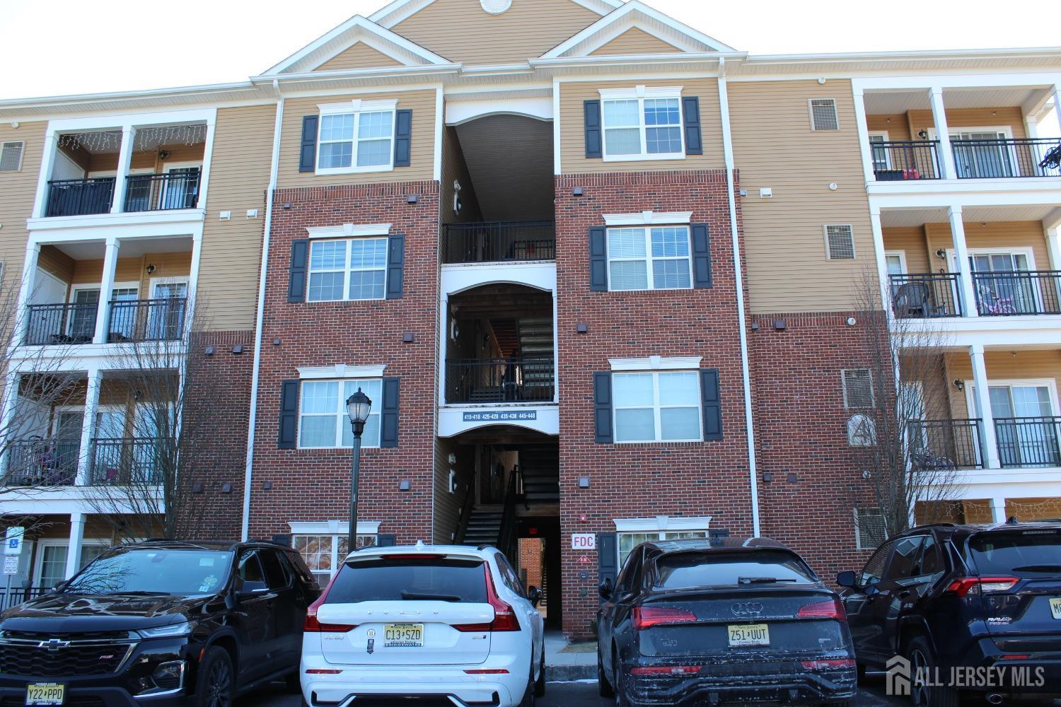 a front view of multiple houses with outdoor space