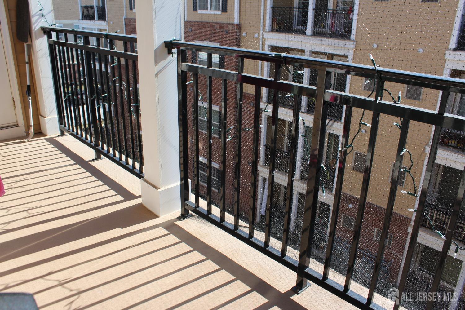 446 Micali Way South Plainfield, NJ 07080 - Photo 13 of 26 a view of a balcony with wooden floor