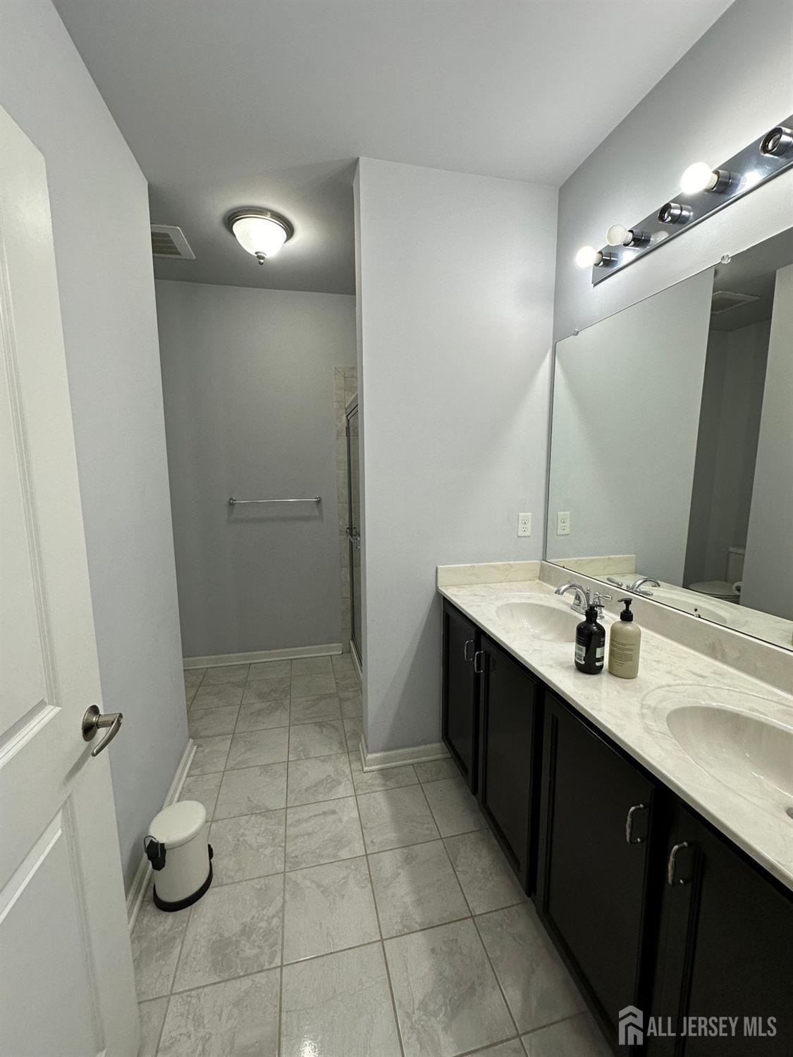 446 Micali Way South Plainfield, NJ 07080 - Photo 14 of 26 a bathroom with a double vanity sink mirror and