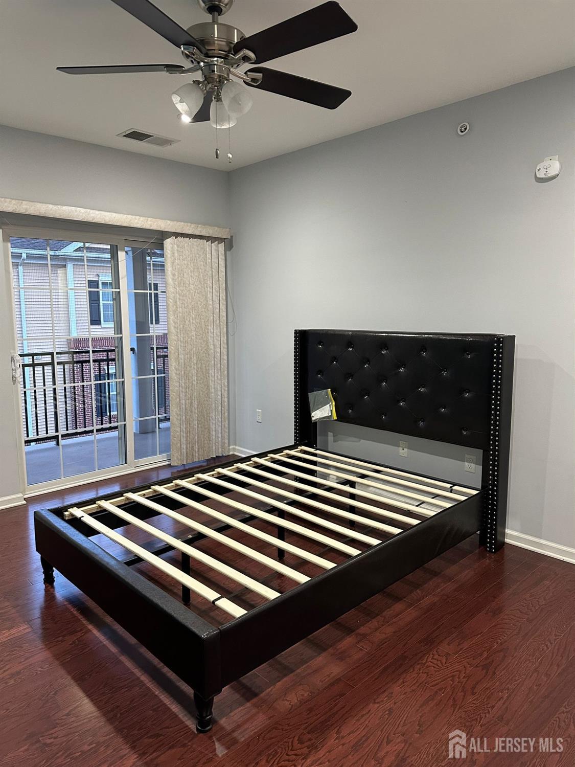 446 Micali Way South Plainfield, NJ 07080 - Photo 16 of 26 a bedroom with wooden floor a ceiling fan and window