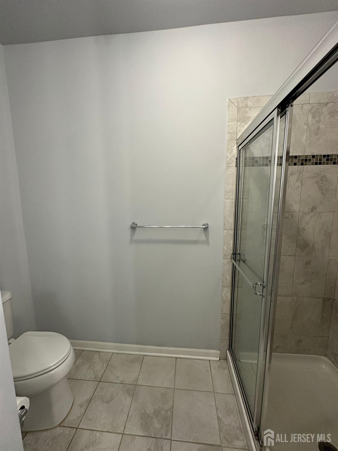 446 Micali Way South Plainfield, NJ 07080 - Photo 18 of 26 a bathroom with a toilet and shower