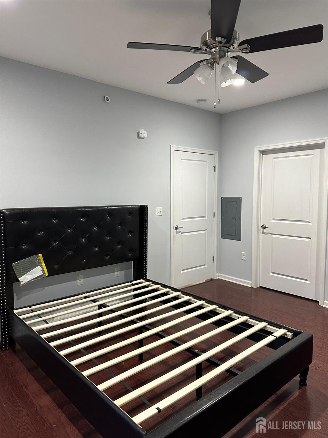 446 Micali Way South Plainfield, NJ 07080 - Photo 19 of 26 a bedroom with a bed and a chandelier