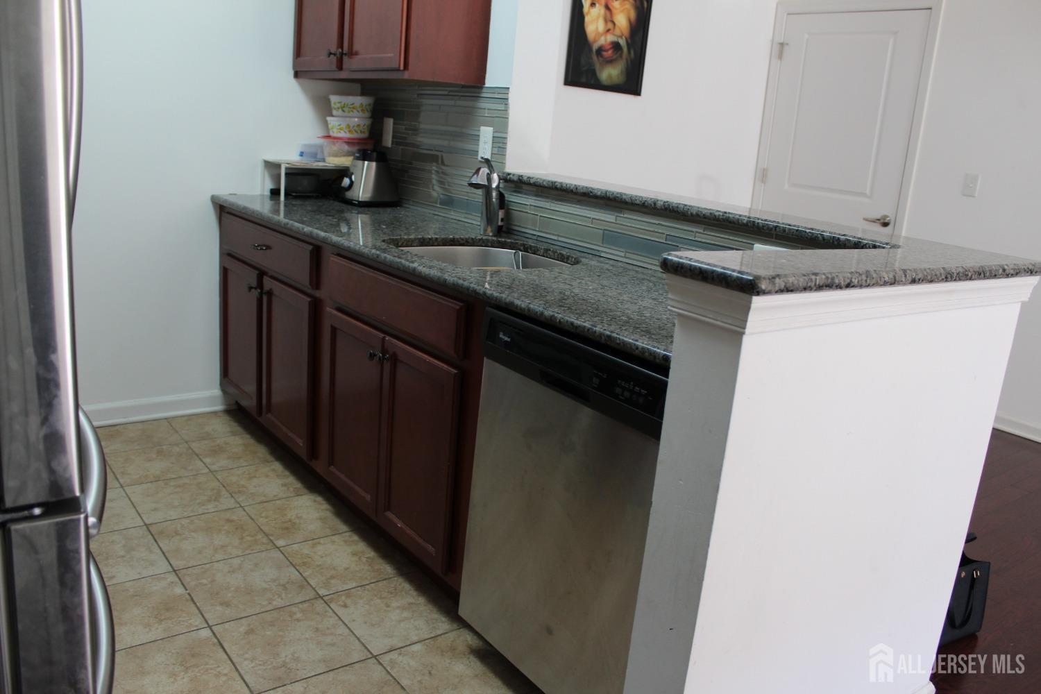 446 Micali Way South Plainfield, NJ 07080 - Photo 8 of 26 a kitchen with granite countertop a sink and a stove