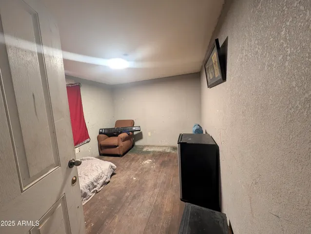 a white toilet sitting next to a shower