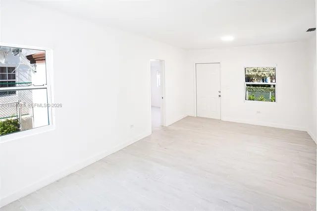 an empty room with windows