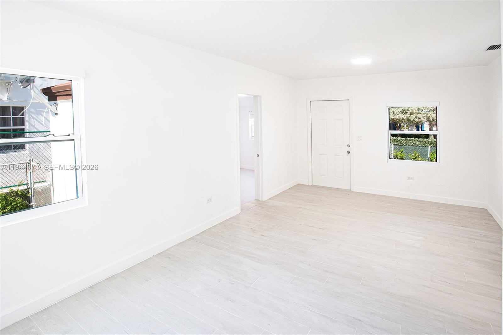 2620 Southwest 9th Street Miami, FL 33135 - Photo 5 of 26 an empty room with windows