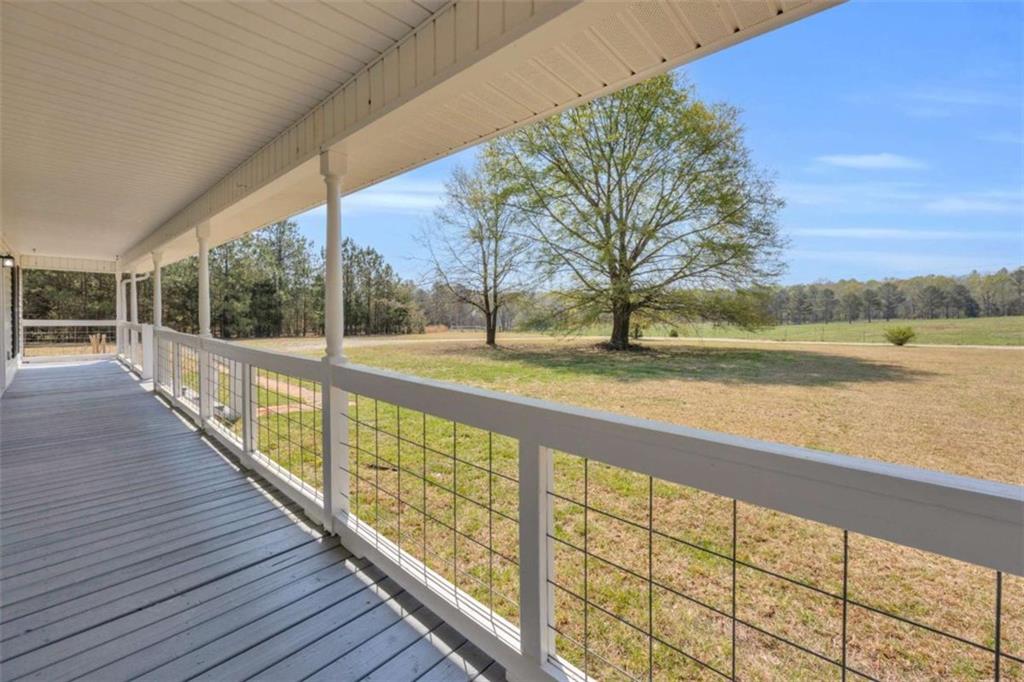 253 Sanders Old Farm Road Crawford, GA 30630 - Photo 11 of 34 a view of outdoor space with wooden deck and lake view