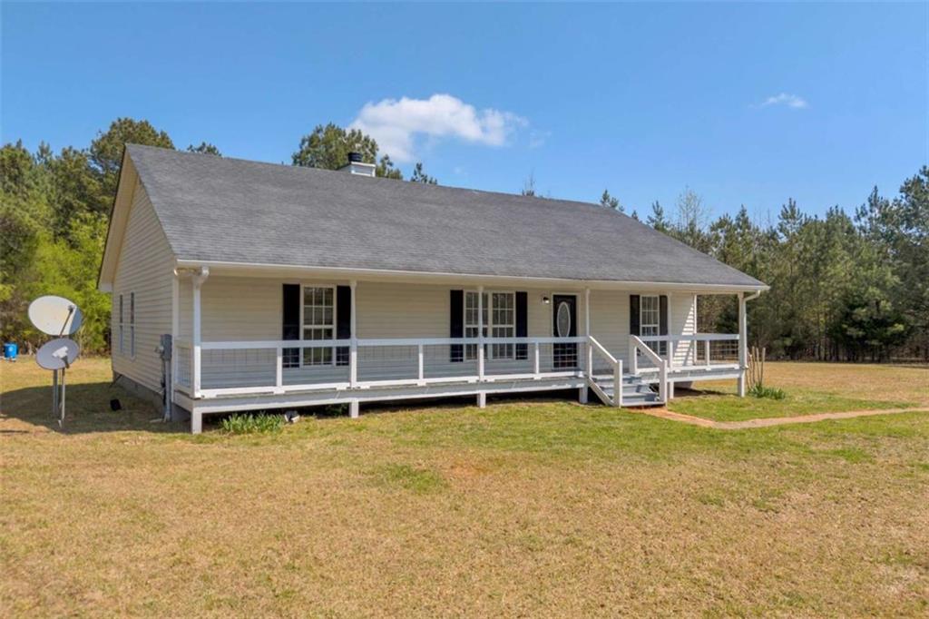 253 Sanders Old Farm Road Crawford, GA 30630 - Photo 6 of 34 a view of a house with swimming pool and sitting area
