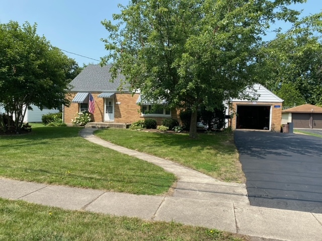 1506 Main Street Crete, IL 60417 - Photo 1 of 17 a front view of a house with a yard