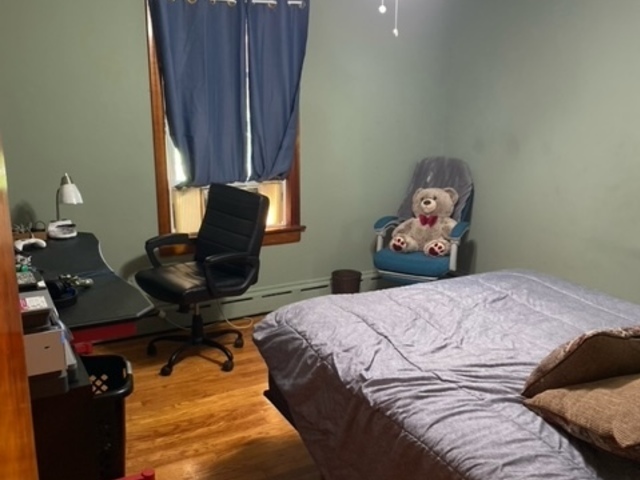 1506 Main Street Crete, IL 60417 - Photo 6 of 17 a bedroom with a bed and wooden floor