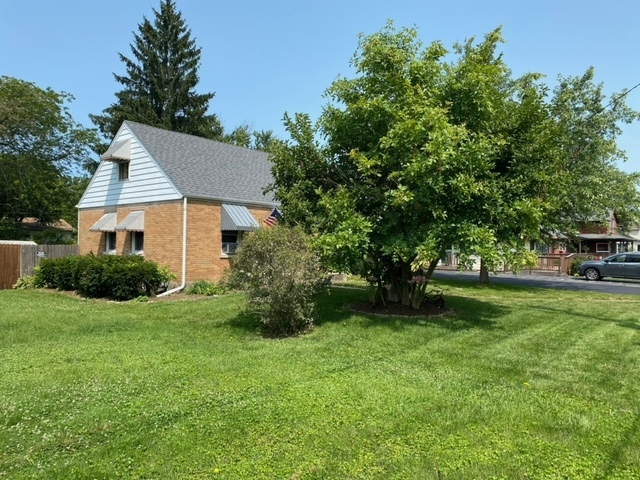 1506 Main Street Crete, IL 60417 - Photo 7 of 17 a view of a house with backyard and garden