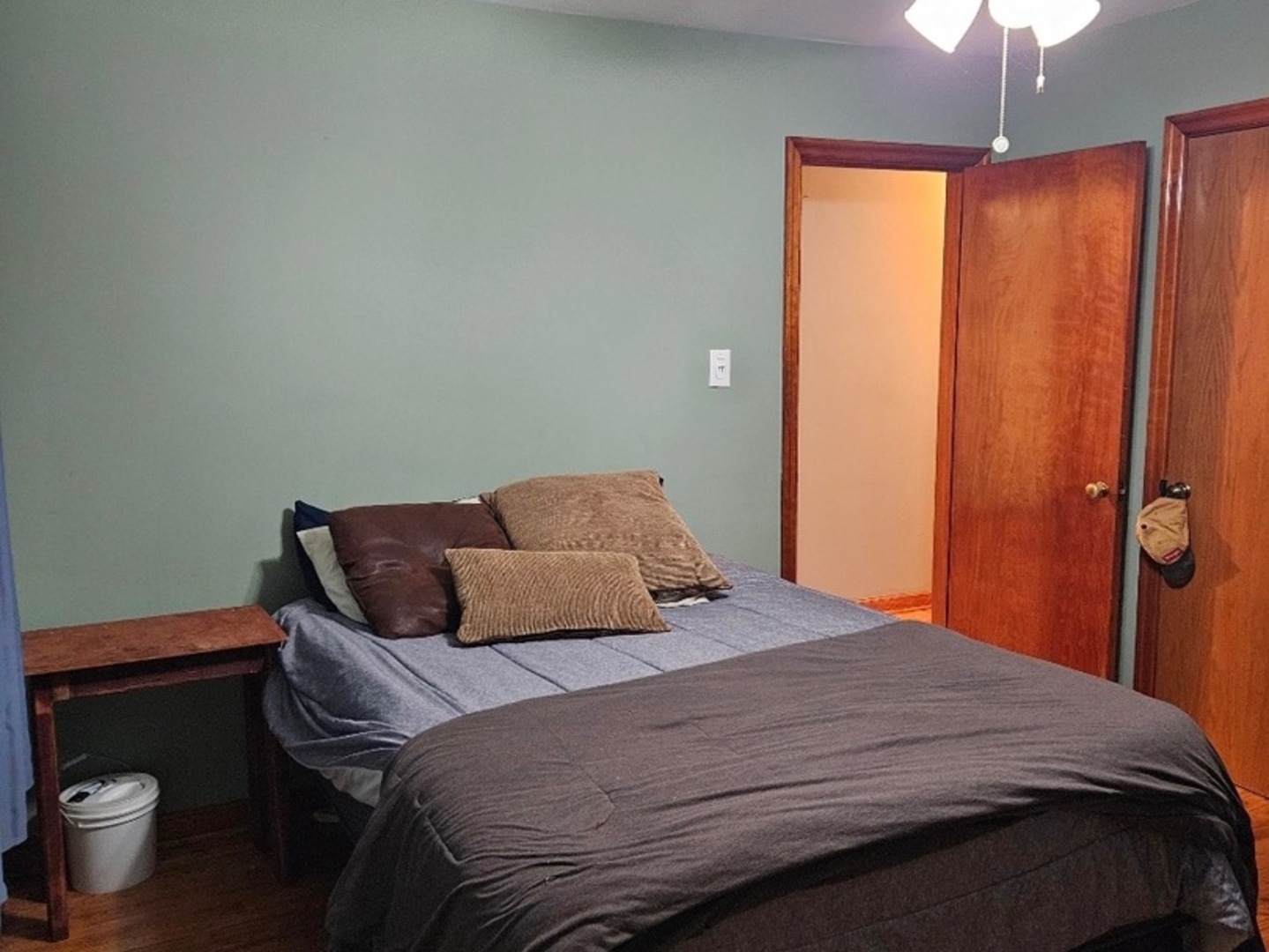 1506 Main Street Crete, IL 60417 - Photo 8 of 17 a bedroom with a bed and a chandelier