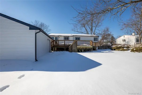 a view of a house with a snow in the yard