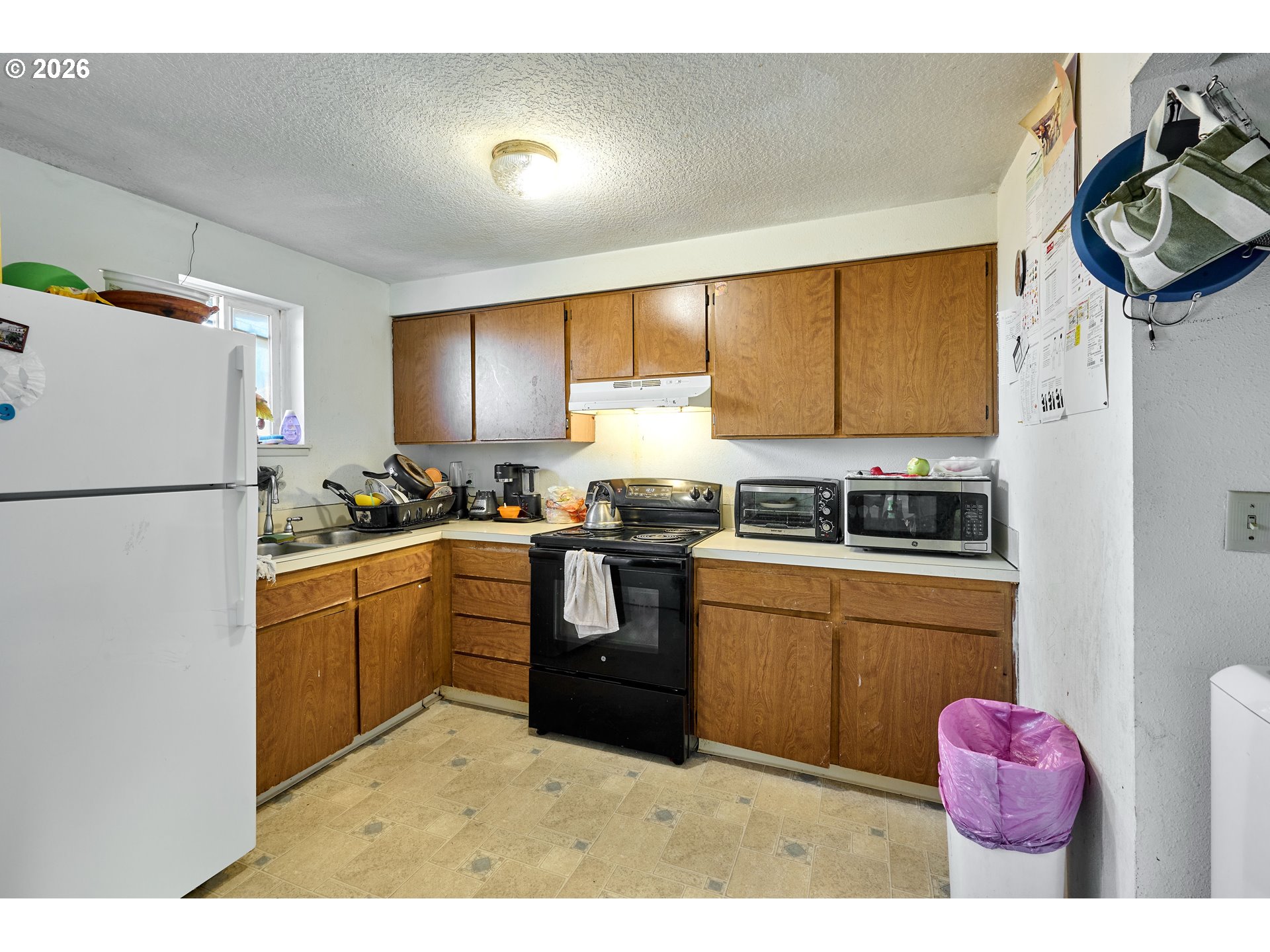 880 North Pershing Street Mount Angel, OR 97362 - Photo 8 of 30 a kitchen with a refrigerator sink and stove top oven