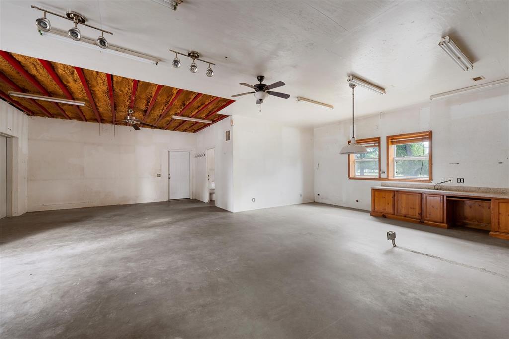 237 Lcr 711 Kosse, TX 76653 - Photo 11 of 40 Unfurnished living room with concrete floors and a ceiling fan