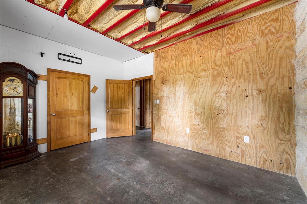 237 Lcr 711 Kosse, TX 76653 - Photo 17 of 40 Empty room featuring concrete floors and ceiling fan