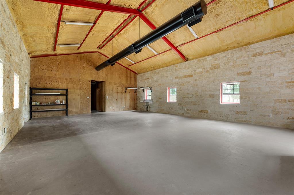 237 Lcr 711 Kosse, TX 76653 - Photo 22 of 40 Garage featuring a garage door opener