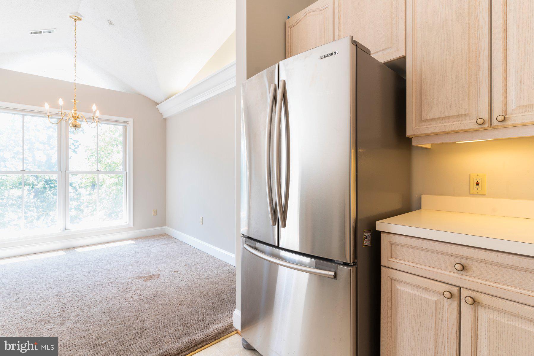 533 Runabout Loop, Unit 533 Solomons, MD 20688 - Photo 14 of 29 a white refrigerator freezer sitting in a kitchen