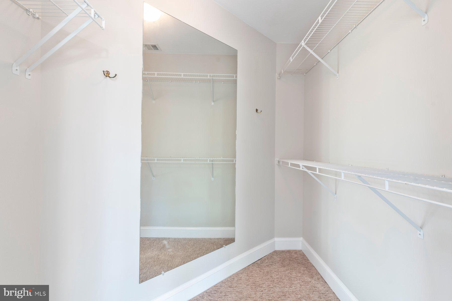 533 Runabout Loop, Unit 533 Solomons, MD 20688 - Photo 18 of 29 a bathroom with a glass shower door