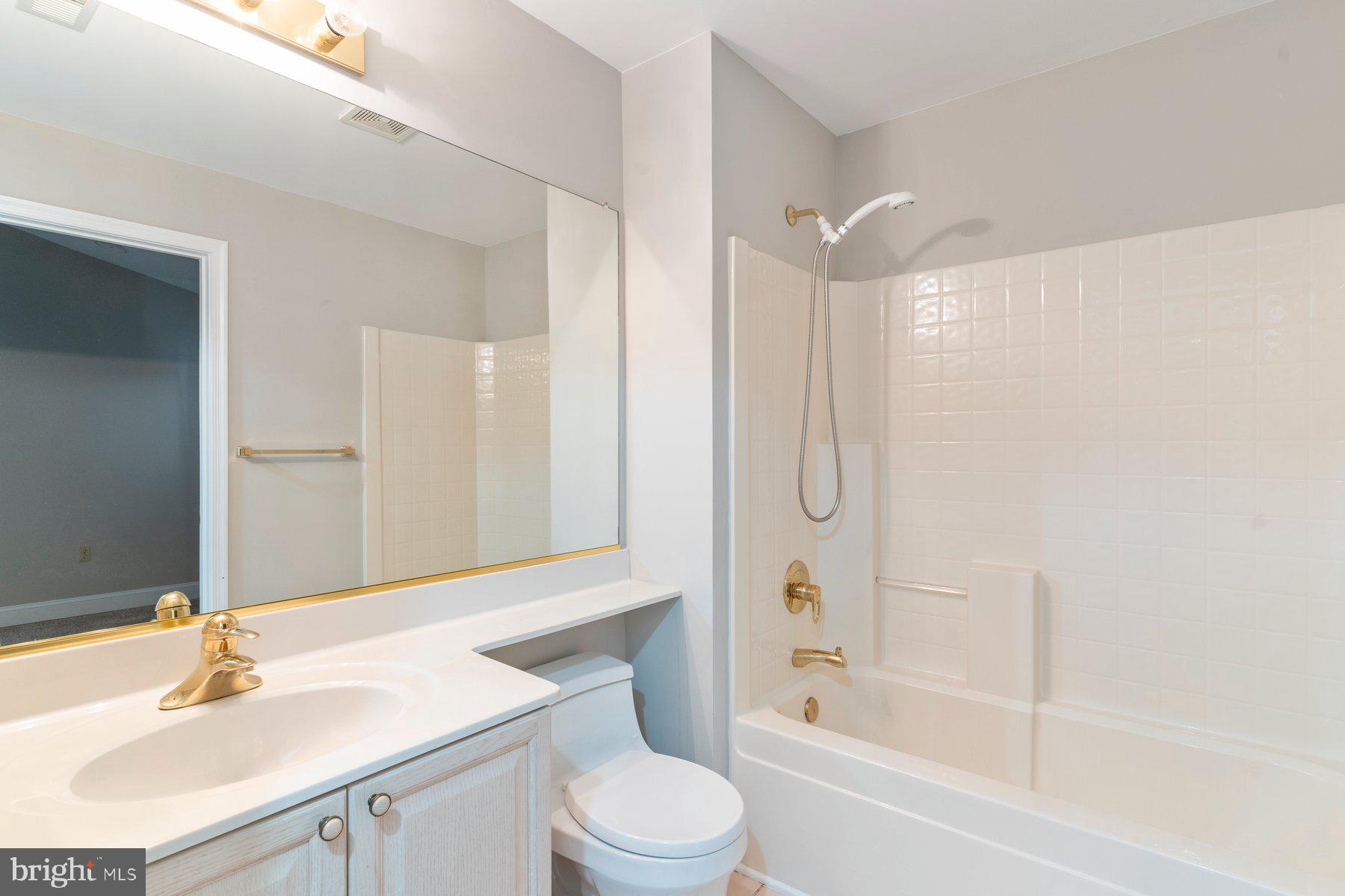 533 Runabout Loop, Unit 533 Solomons, MD 20688 - Photo 5 of 29 a bathroom with a sink toilet and shower
