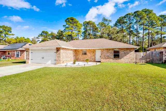 a house view with swimming pool in front of it