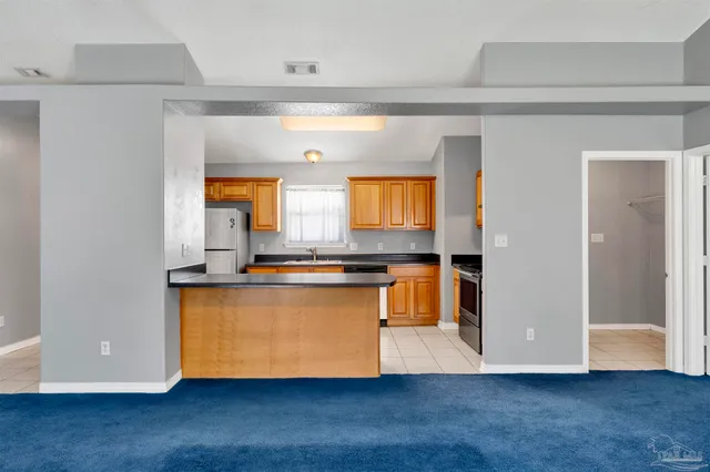 a room with wooden floor and window