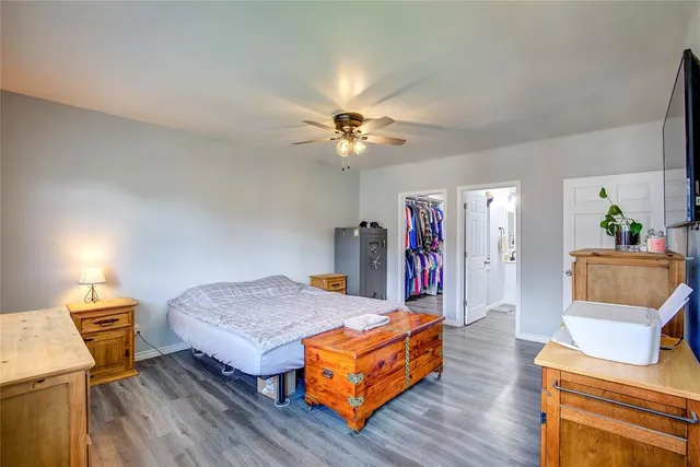 a living room with furniture and a ceiling fan