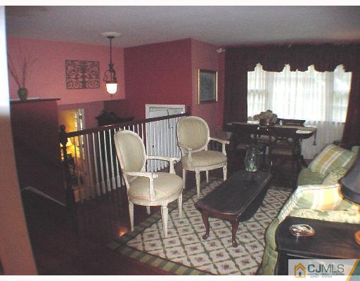 17 Simpson Road Somerset, NJ 08873 - Photo 5 of 8 a living room with furniture and a lamp
