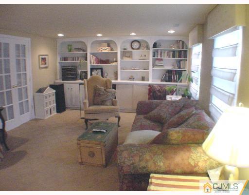 17 Simpson Road Somerset, NJ 08873 - Photo 6 of 8 a living room with furniture cabinets and a table