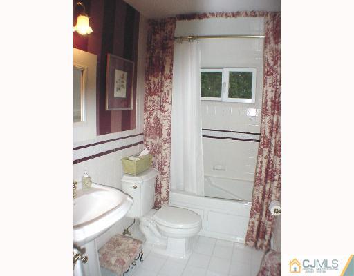 17 Simpson Road Somerset, NJ 08873 - Photo 8 of 8 a bathroom with a sink toilet and shower