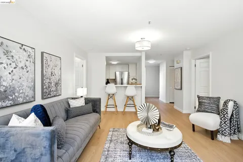 a living room with furniture or couch and a dining table