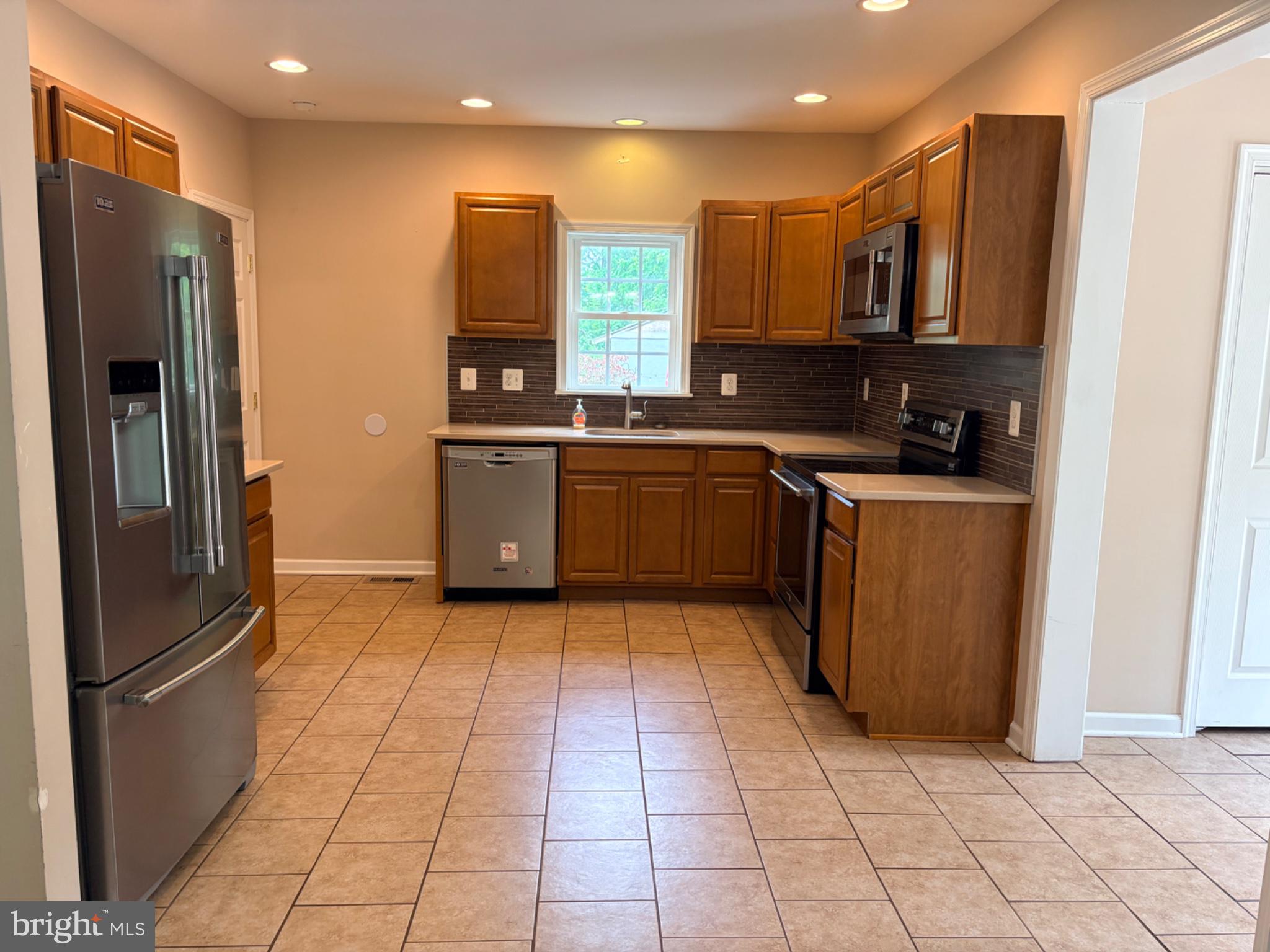 2831 Reckord Road Fallston, MD 21047 - Photo 5 of 8 Modern kitchen with warm wood tones.