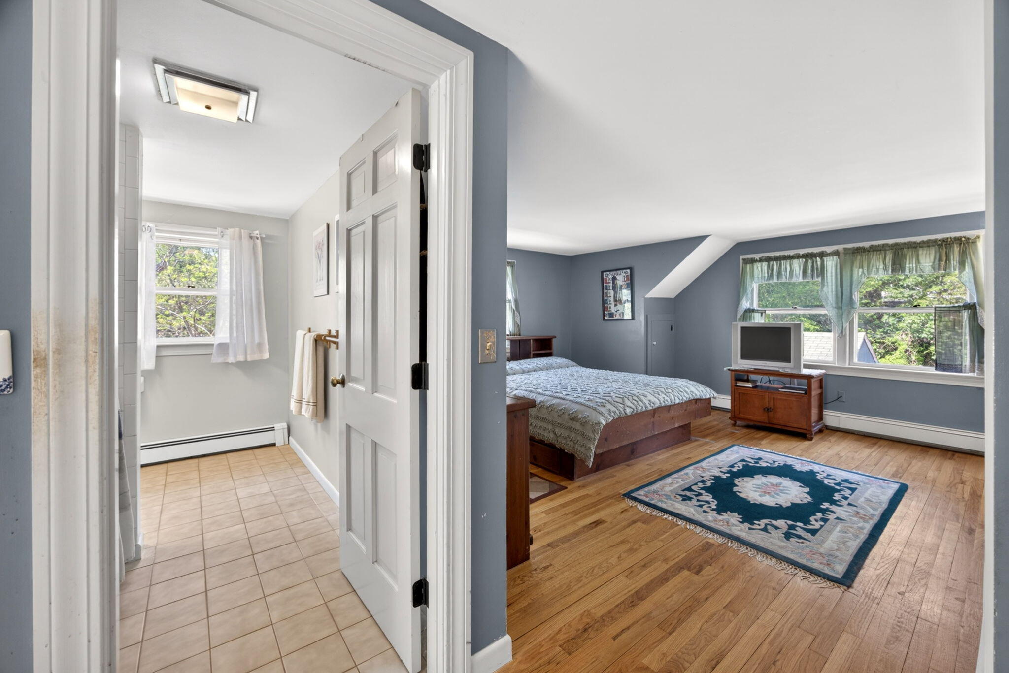 23 Nickerson Road Orleans, MA 02653 - Photo 18 of 54 a bedroom with furniture and a window