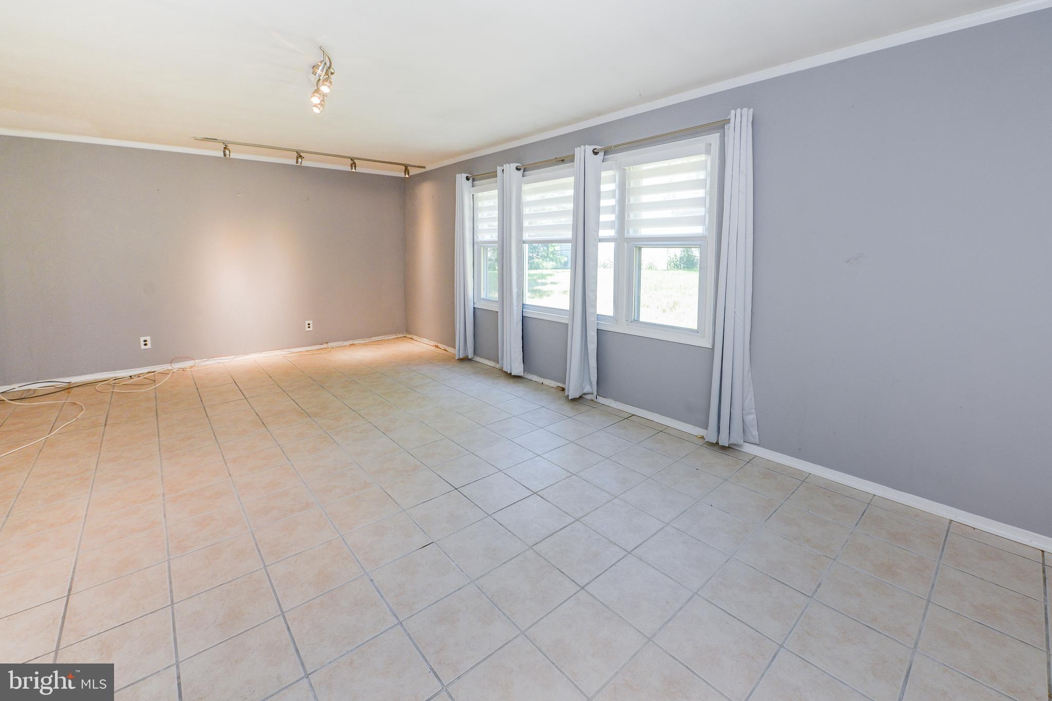 114 Yardley Road Deptford, NJ 08096 - Photo 19 of 41 a view of an empty room with a window