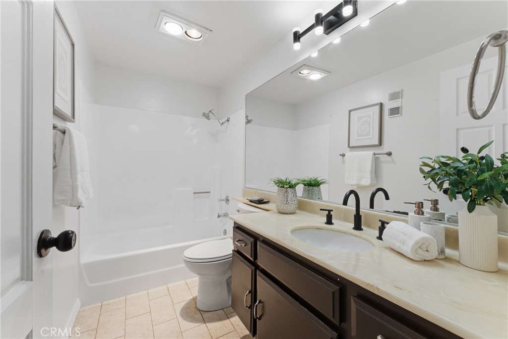 8180 Manitoba Street, Unit 330 Playa del Rey, CA 90293 - Photo 22 of 31 a bathroom with a sink a toilet and shower