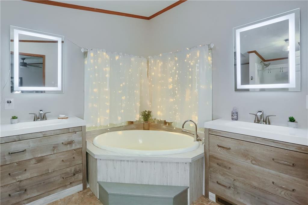 123 Merle Lane New Castle, PA 16101 - Photo 29 of 47 a bathroom with a tub sink and mirror