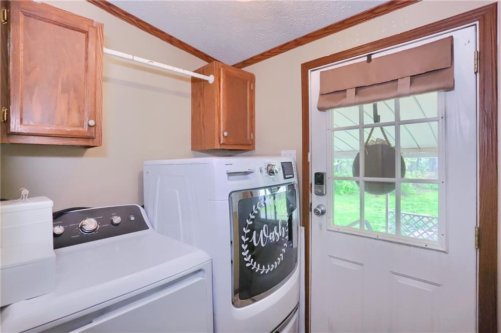 123 Merle Lane New Castle, PA 16101 - Photo 5 of 47 a utility room with a window dryer and washer