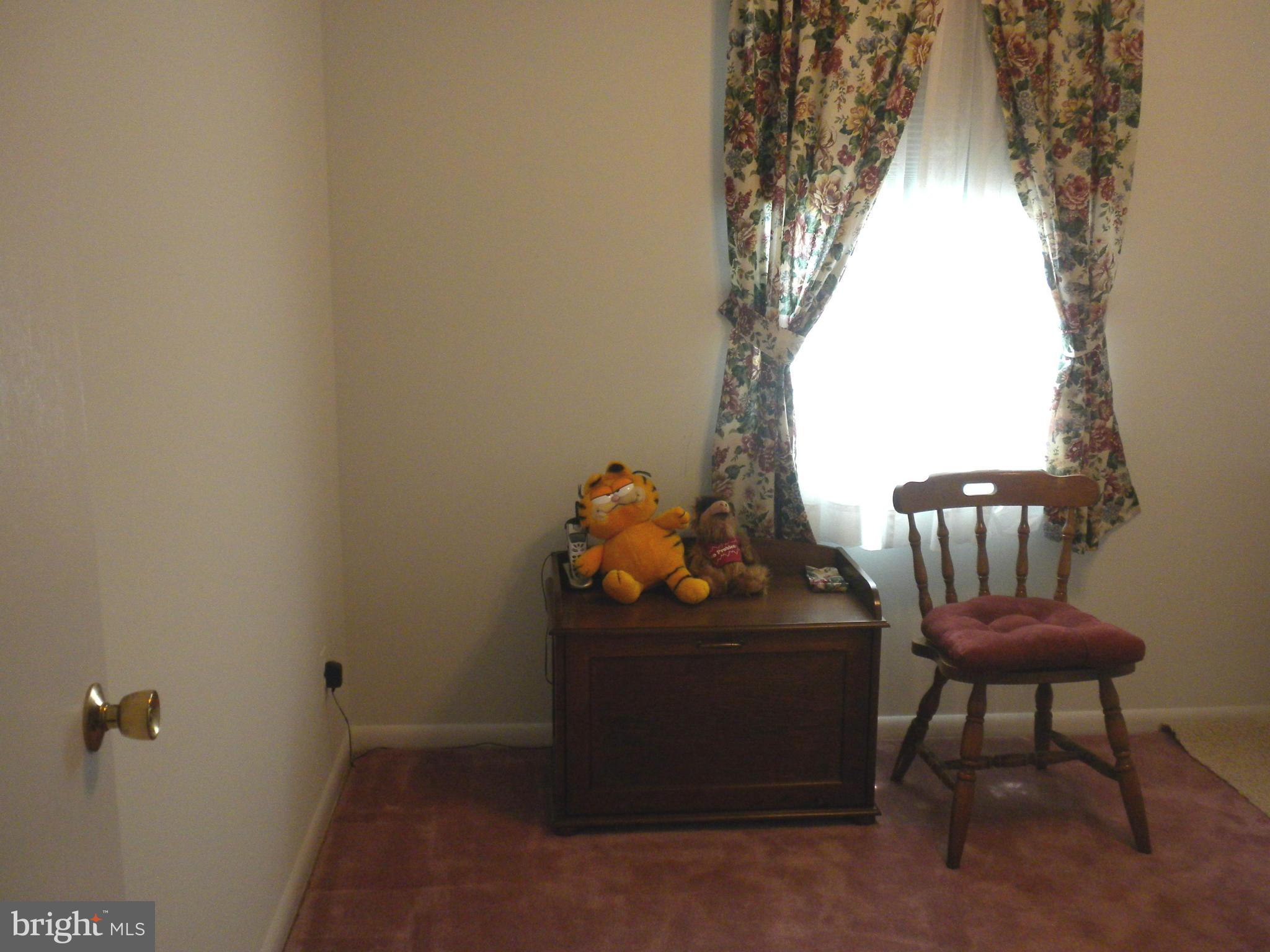 2114 Gaybrook Road Baltimore, MD 21244 - Photo 11 of 19 a room with a chair and a window