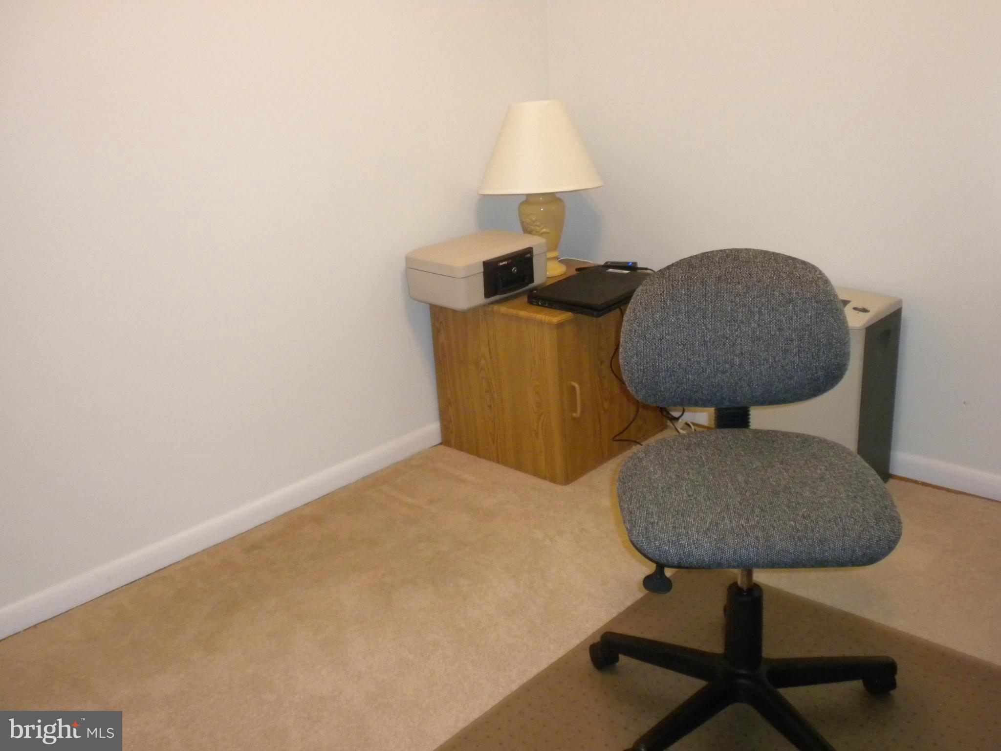 2114 Gaybrook Road Baltimore, MD 21244 - Photo 12 of 19 a bedroom with a bed and a chair