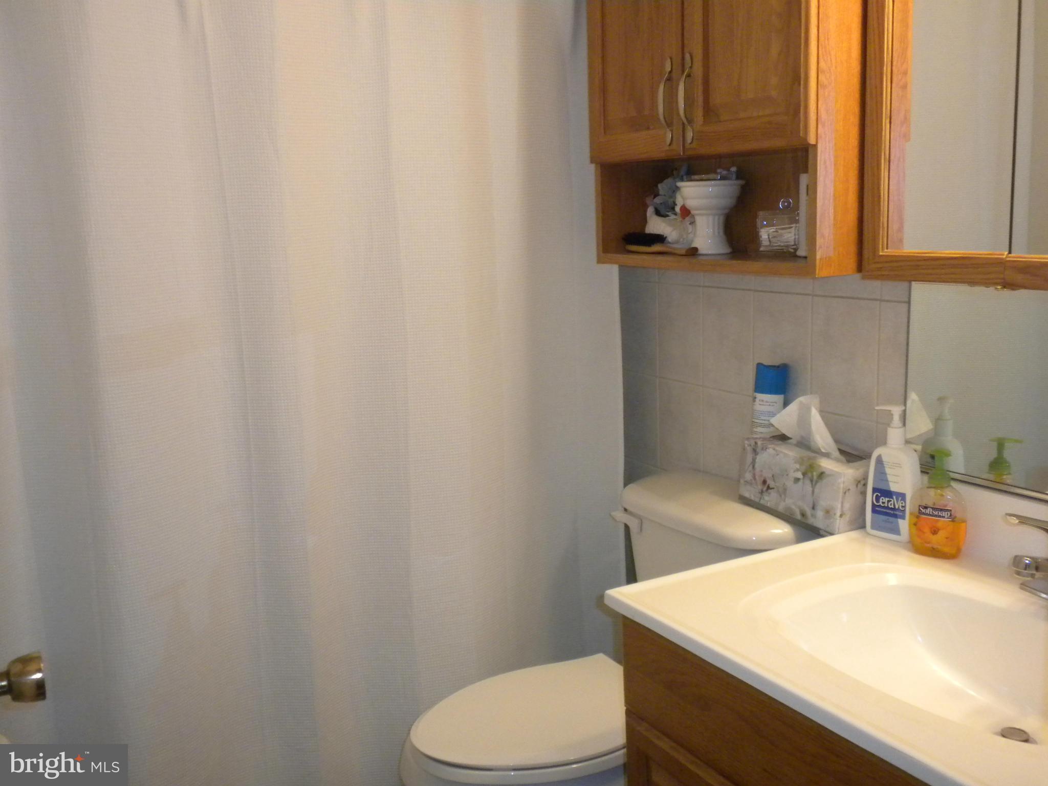 2114 Gaybrook Road Baltimore, MD 21244 - Photo 13 of 19 a bathroom with a sink a toilet and vanity